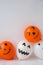 Painted Jacks face on balloons. Orange and white balls preparation diy for halloween party. Halloween home activities