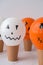 Painted Jacks face on balloons. Orange and white balls preparation diy for halloween party. Halloween home activities