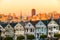 The Painted Ladies of San Francisco, California sit glowing amid