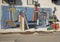 Painted mural with young people, books and Broncho on the side of the student bookstore of the University of Central Oklahoma.