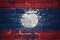 Painted national flag of laos on a brick wall