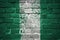 Painted national flag of nigeria on a brick wall