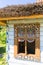 Painted old wooden cottage decorated with a hand painted colorful floral motives, folk art, Zalipie, Poland