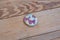 painted pebbles, Stones painted birds and flowers, Decoration. on a wooden table.