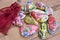 painted pebbles, Stones painted birds and flowers, Decoration. on a wooden table.