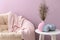 Painted pumpkins on white table in interior of room