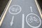 Painted signs on asphalt for bicycle dedicated lanes. A separate bike path in the city