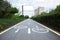 Painted signs on asphalt for bicycle dedicated lanes. A separate bike path in the city, cyclists on the cycle track