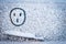 Painted on snow above windshield wiper of car surprised, shocked, astonishment face symbol. Change of weather, cooling.
