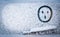 Painted on snow above windshield wiper of car surprised, shocked, astonishment face symbol. Change of weather, cooling, snowfall