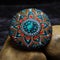 Painted stone with colorful mandala decoration