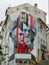 painted wall in PraÃ§a do Commercio in front of the church of SÃ£o Bartolomeu in the city of Coimbra.