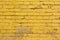 Painted yellow brick wall background texture in bright tints.