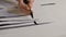 Painter Draws Lines Wide Brush Strokes Closeup