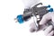 A painter\'s arm hand holding industrial size spray gun used for