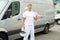 Painter Standing In Front Of Van