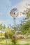 Painterly converted image of an Australian Windmill that have successfully pumped water in the Australian Outback into troughs for