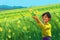 A painting of a boy in a field holding a bunch of flowers. AI generative image