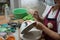 Painting chicken patternon on white ceramic bowl , the famous chicken bowl and ceramic of Lampang