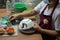 Painting chicken patternon on white ceramic bowl , the famous chicken bowl and ceramic of Lampang