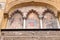 Painting the facade of the door of the el Perdon, Moorish facade of the Great Mosque in Cordoba, Andalusia, Spain