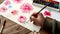 Painting pink flower with watercolors close up