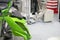 The painting robot spray the green color to the motorcycle mask parts.