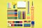 Painting supplies on a colored background. Set of first grader on background.