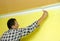 Painting a wall in yellow