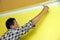 Painting a wall in yellow