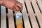 Painting wooden furniture with varnish. a man hides a tree with varnish.