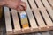 Painting wooden furniture with varnish. a man hides a tree with varnish.