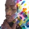 Paintography. A portrait of a man combined with colorful watercolor splashes.