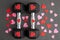 Pair of 15-pound dumbbells on a black gym floor, red and pink sparkly hearts