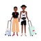 Pair of African American boy and girl dressed in stylish clothing standing together and holding suitcases. Traveling