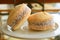 Pair of Alfajores, Traditional Latin American Sweetened Milk Filling Cookies Served on White Plate