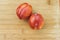 Pair of Amigo Pluots on a Wood Chopping Board