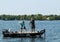 Pair of Anglers Fishermen in Boat Landing and Netting a Smallmouth Bass