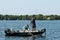 Pair of Anglers Fishermen in Boat Landing and Netting a Smallmouth Bass