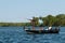 Pair of Anglers Fishermen Fish for Bass in a Boat During the Summer