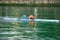 Pair of athletes training in a canoe on the Nervion River in Bilbao, Spain