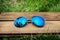 A pair of aviator sunglasses on green grass