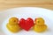 Pair of Baby Duck with Red Heart Marzipans, Thai Traditional Kanom-Look-Choup Sweets Served on White Plate