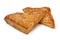 Pair of baked puff apple triangles pastry as a snack close up on white background