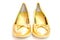 Pair of ballet flats in golden colour on white background.