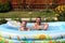 Pair bathes in inflatable pool