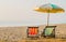 Pair of beach loungers on the deserted coast