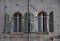 Pair of beautiful arched windows decorated on the wall of a historic building in Verona.