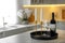 Pair of beautiful golden candlesticks and wine on white marble table in kitchen, space for text