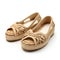 Pair of beige sandals isolated on a white background